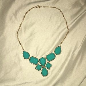 Short turquoise necklace with a gold chain